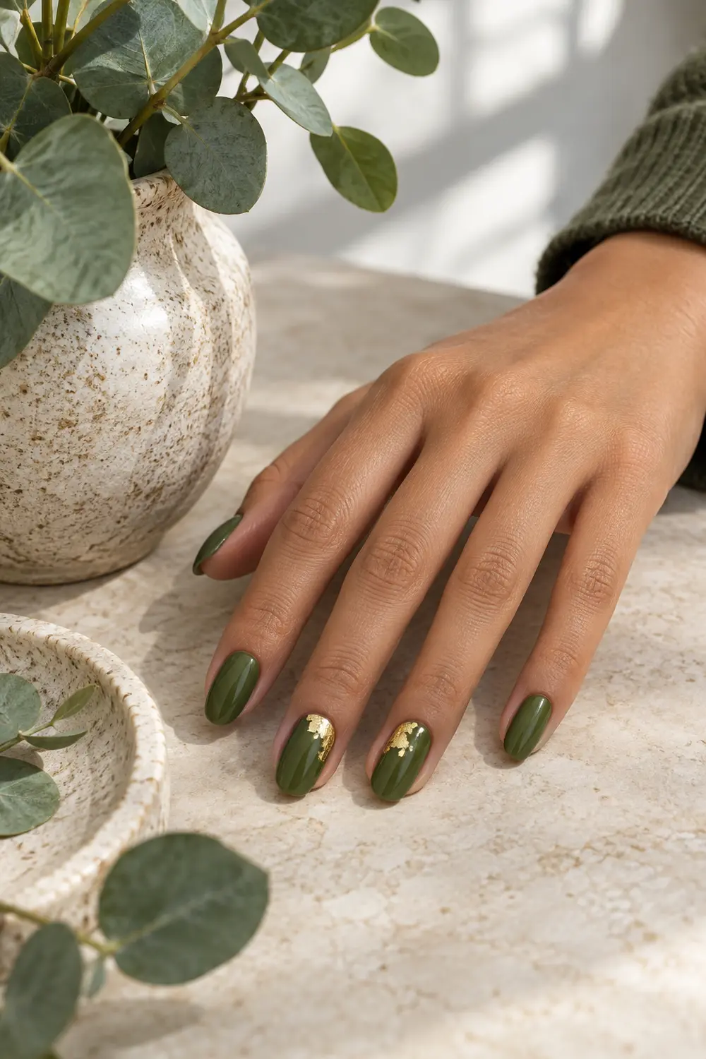 Moss green nails with gold foil accents