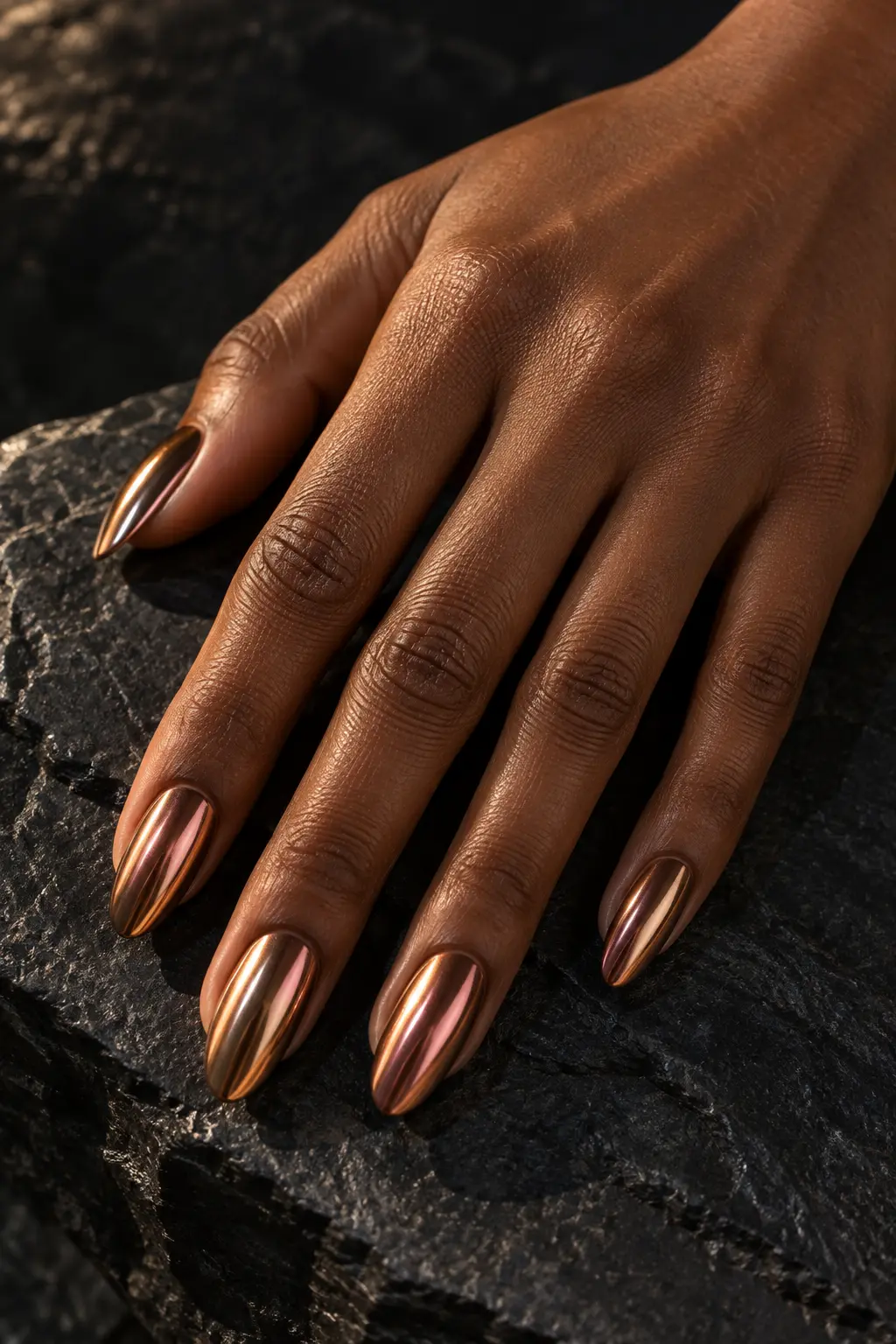 Reflective copper chrome polish on almond nails