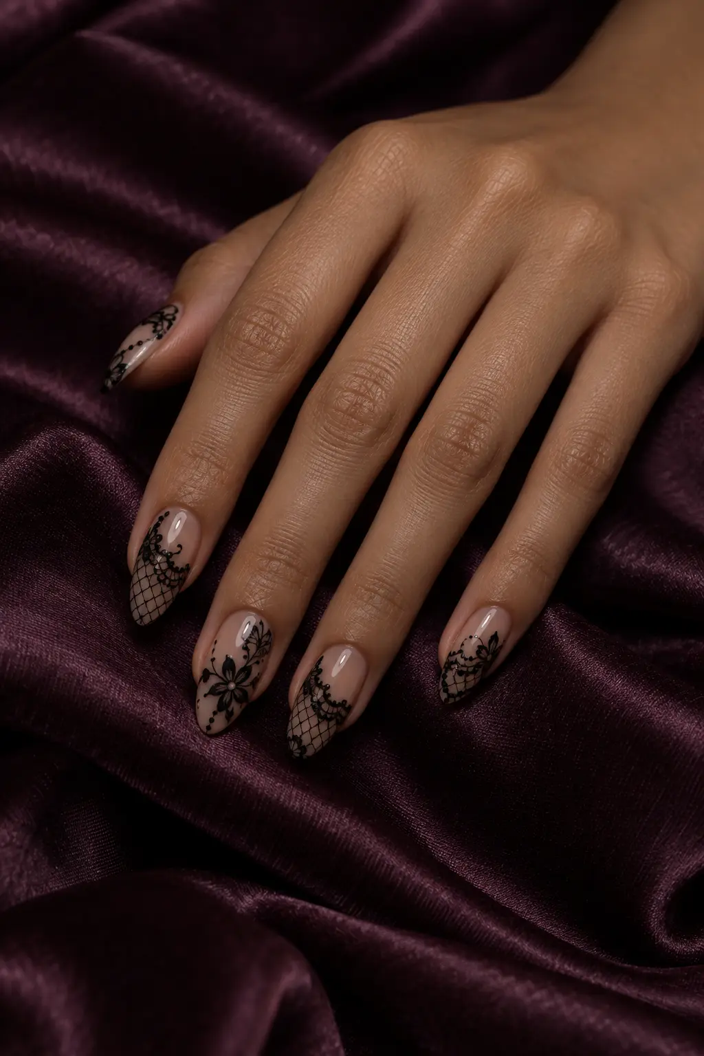Elegant sheer nude nails with fine black lace Halloween details