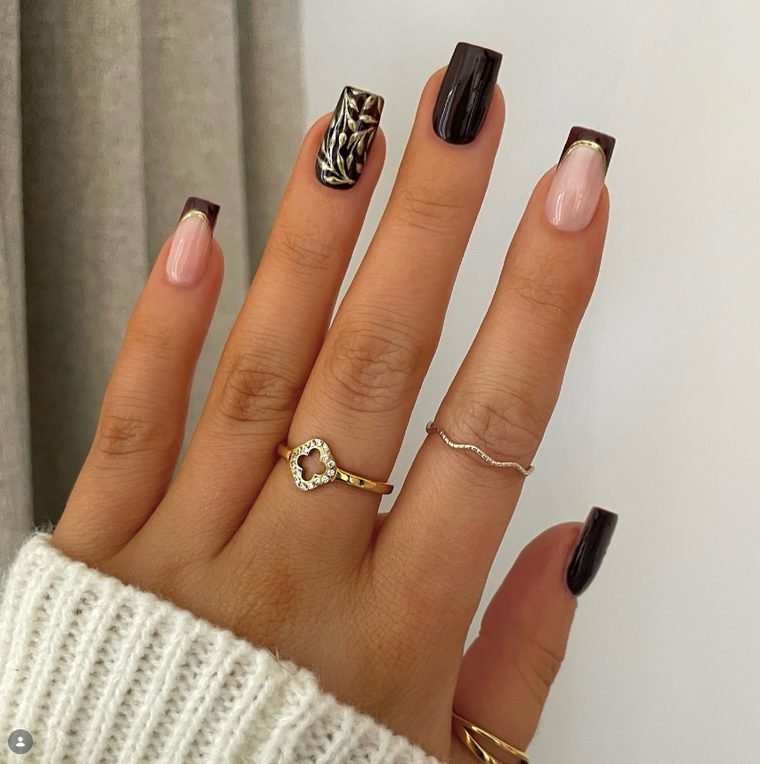 Square nails in dark chocolate brown with gold chrome leaves and nude nails with brown French tips edged in gold