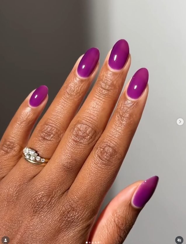 Oval nails in a glossy see-through grape purple jelly polish