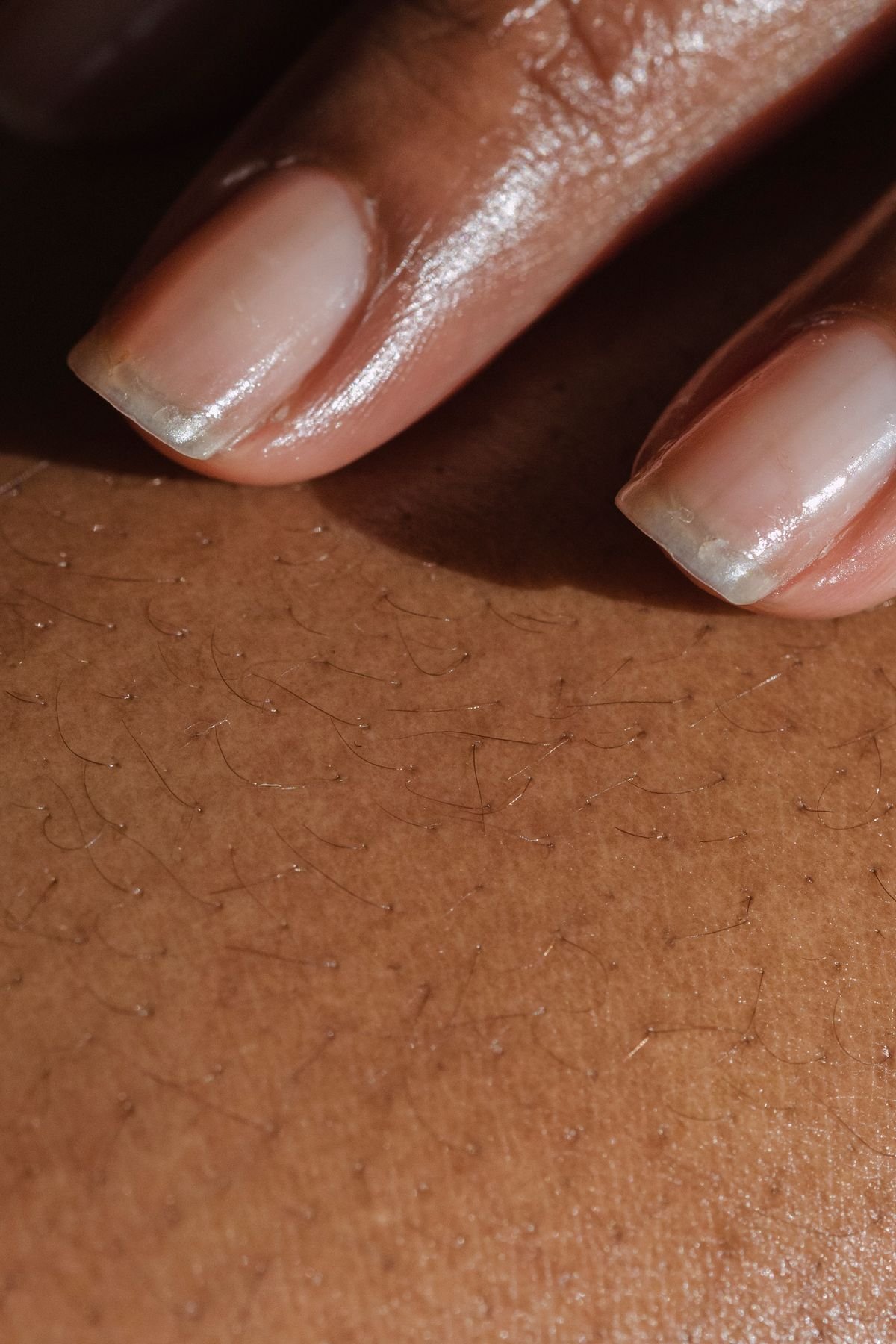 Close-up of fingers with short natural fingernails